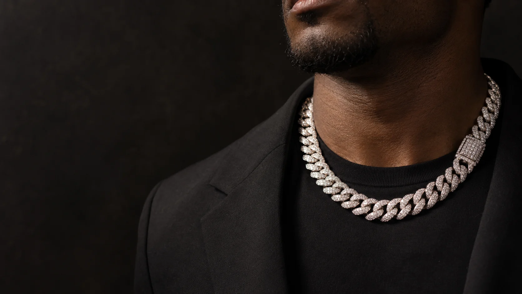 AI-generated styling illustration of a diamond-set Cuban necklace worn with a black jacket