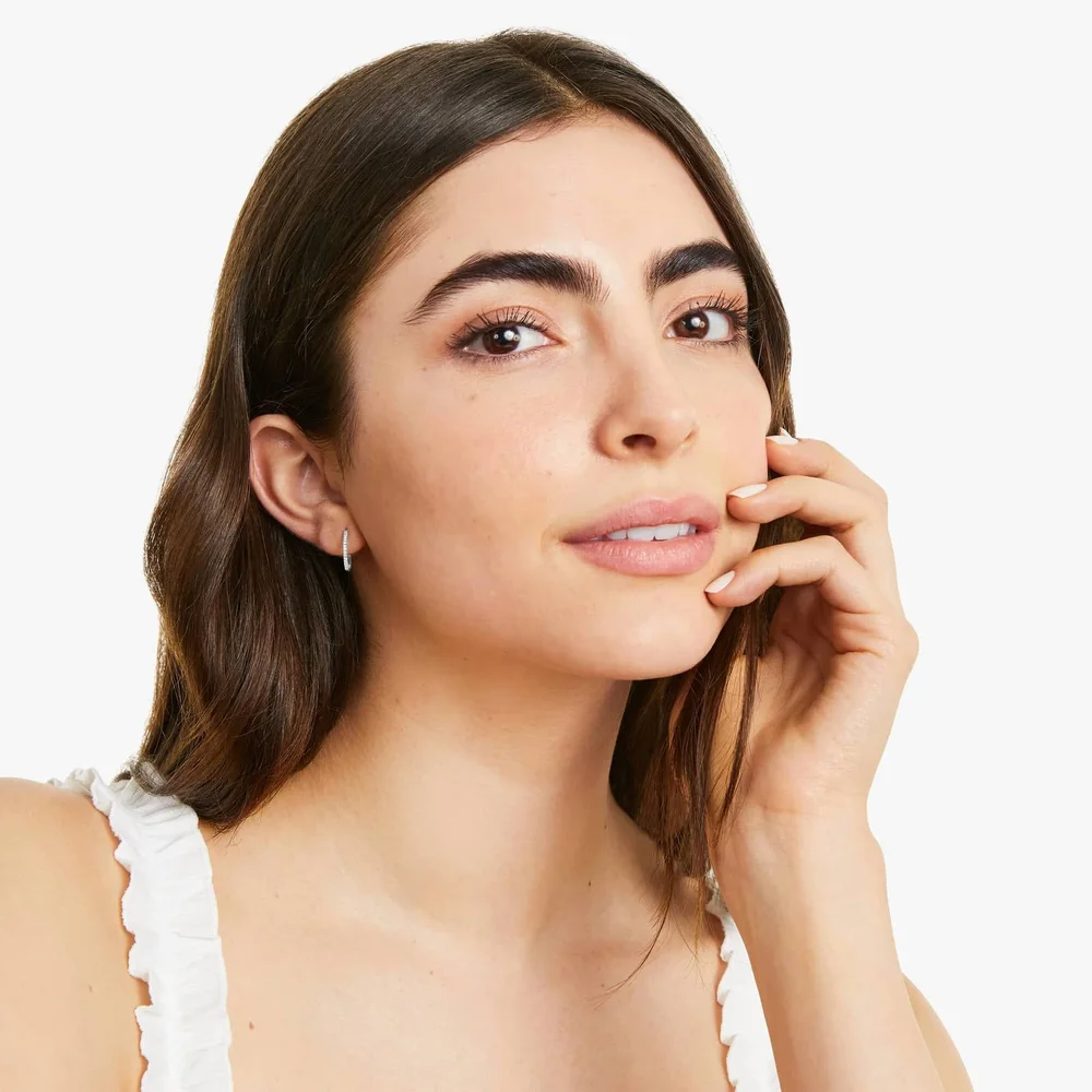 Diamond Huggie Hoops — On ear