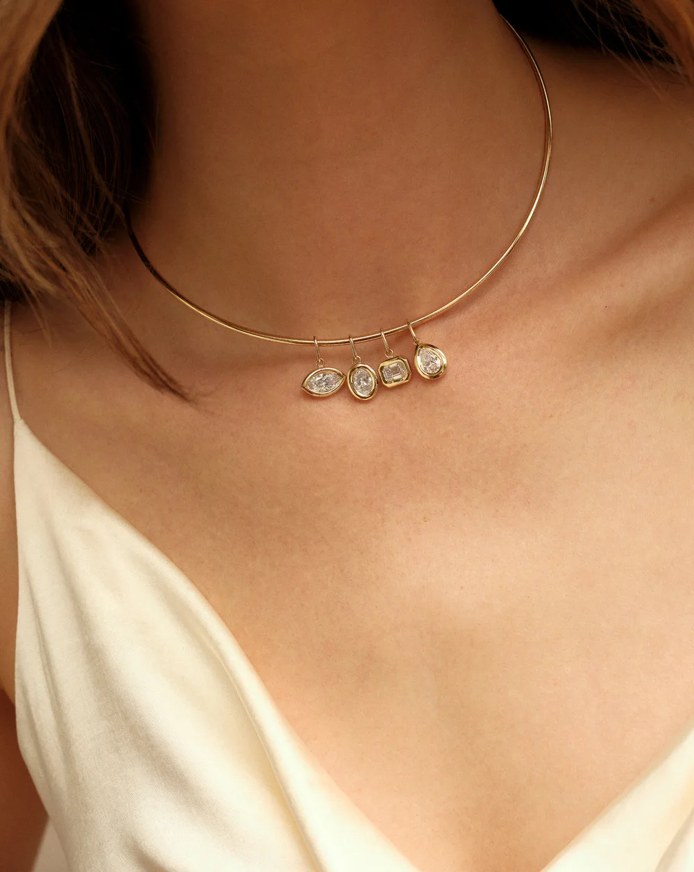 Framed Pear Diamond Pendant — On body · styled with other diamond pendants